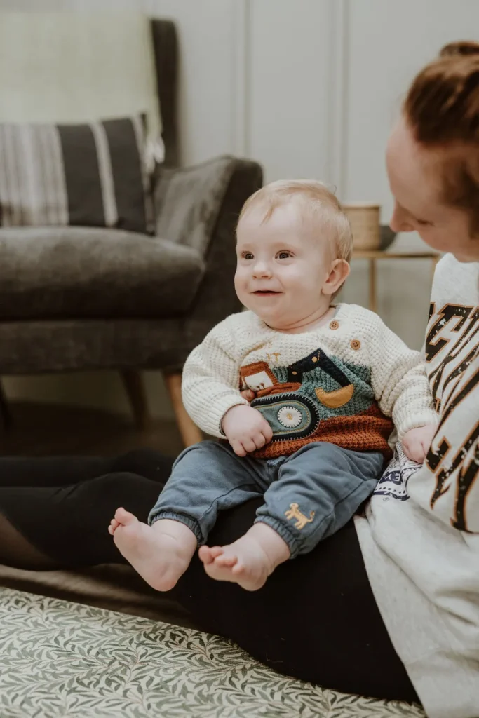 baby sat on mum's lap
